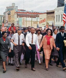 Dr. King and Mrs. King lead a 5-day march from Selma, AL to the state capitol in Montgomery, AL from March 21-25 1965